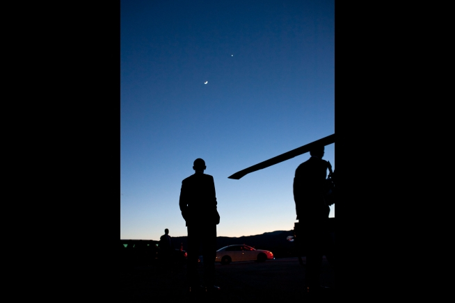 President Obama eyes Venus and the crescent moon in Colorado on April 24, 2012.