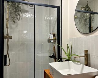 My bathroom with floor to ceiling tiled shower area crittal black frame shower screen and tiled backsplash
