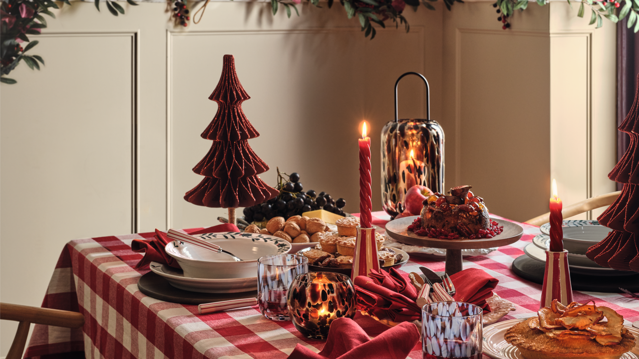 M&amp;S tablescape with red check tablecloth, glittery red paper tree and long red twisted candles