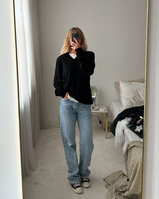 @_jeanettemadsen_ wearing black Converse with jeans