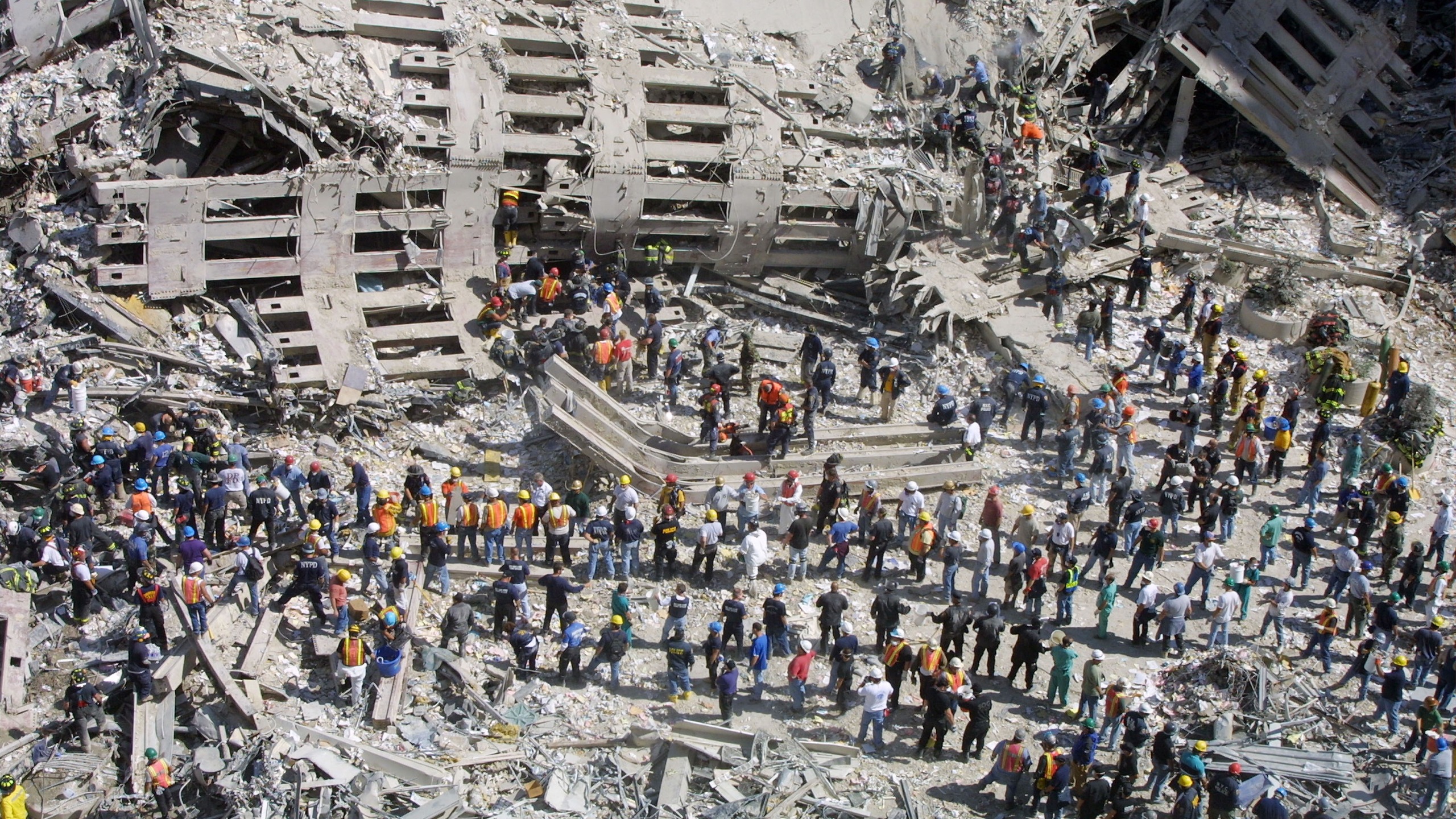 Rescue workers sift through the wreckage of the World Trade Center September 13, 2001 in New York City, two days after two hijacked airplanes slammed into the twin towers, leveling them in an alleged terrorist attack.