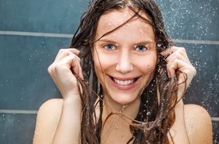 Natural remedies for hair loss Woman in shower