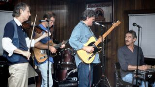 Don Everly (second from right), of the popular duo The Everly Brothers, enjoys a jam session with friends at the singer's Kentucky inn (Everly's Lake Malone Inn) in 1998. Everly, who was born in Kentucky, bought the inn in 1997 and enjoyed meeting guests and Everly Brothers fans. Playing with Everly are, from left: John Hartford and his son, Jamie Hartford. At far right is veteran country music pedal steel guitar player Buddy Emmons. The historic Kentucky inn burned to the ground in 2005.