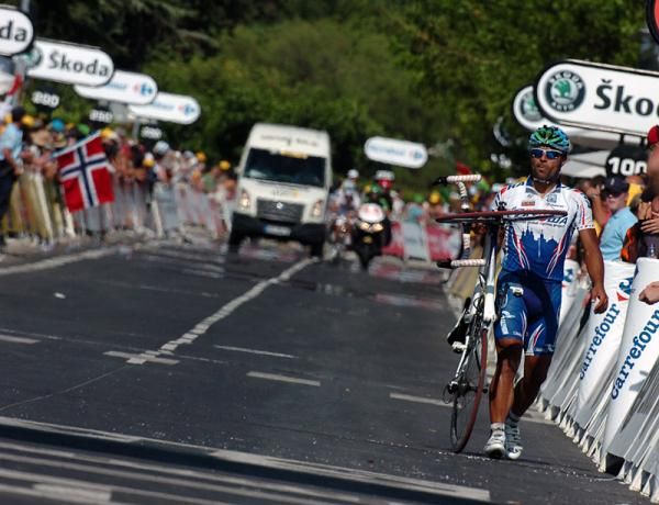 Danilo Napolitano (Team Katusha) walks across the finish line after being involved in a crash at the last turn.