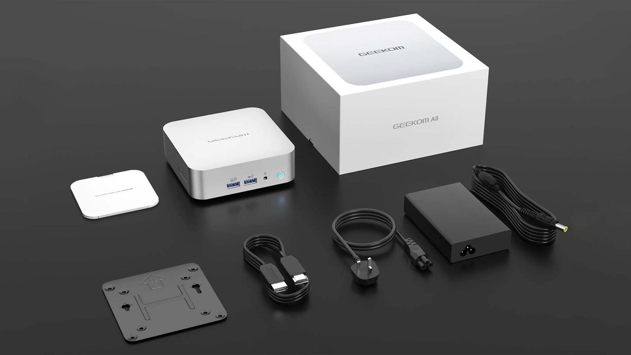 Geekom A8 with manual, VESA mount, HDMI cable, and power cable.