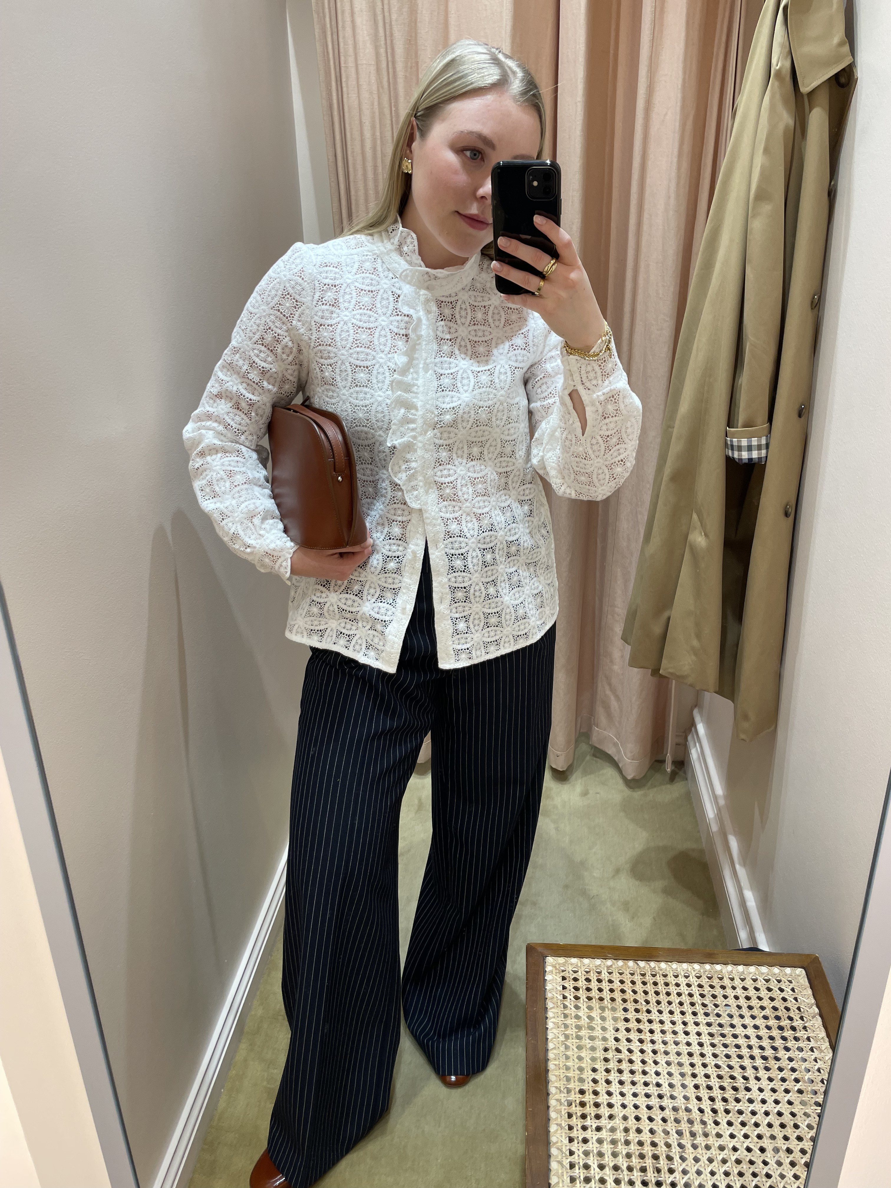 Florrie wears the Chlo shirt from Sezane, striped tailored trousers and burgundy heels