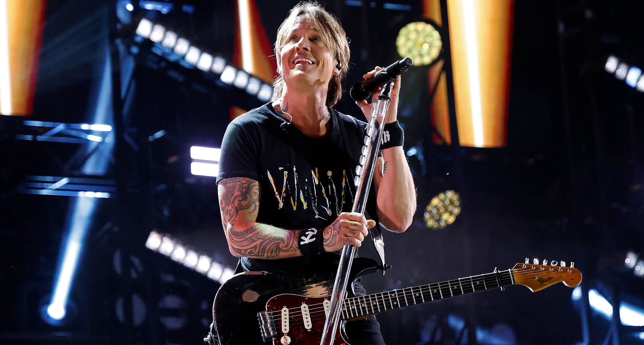 Keith Urban addressed the crowd during his 2025 performance at the Nissan Stadium, Nashville. He is playing a Fender Stratocaster