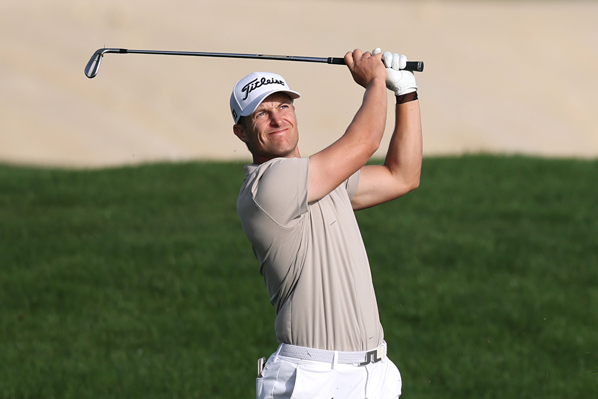 Calum Hill hits a wedge shot