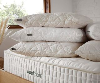 Woolroom pillows stacked on a Woolroom mattress.