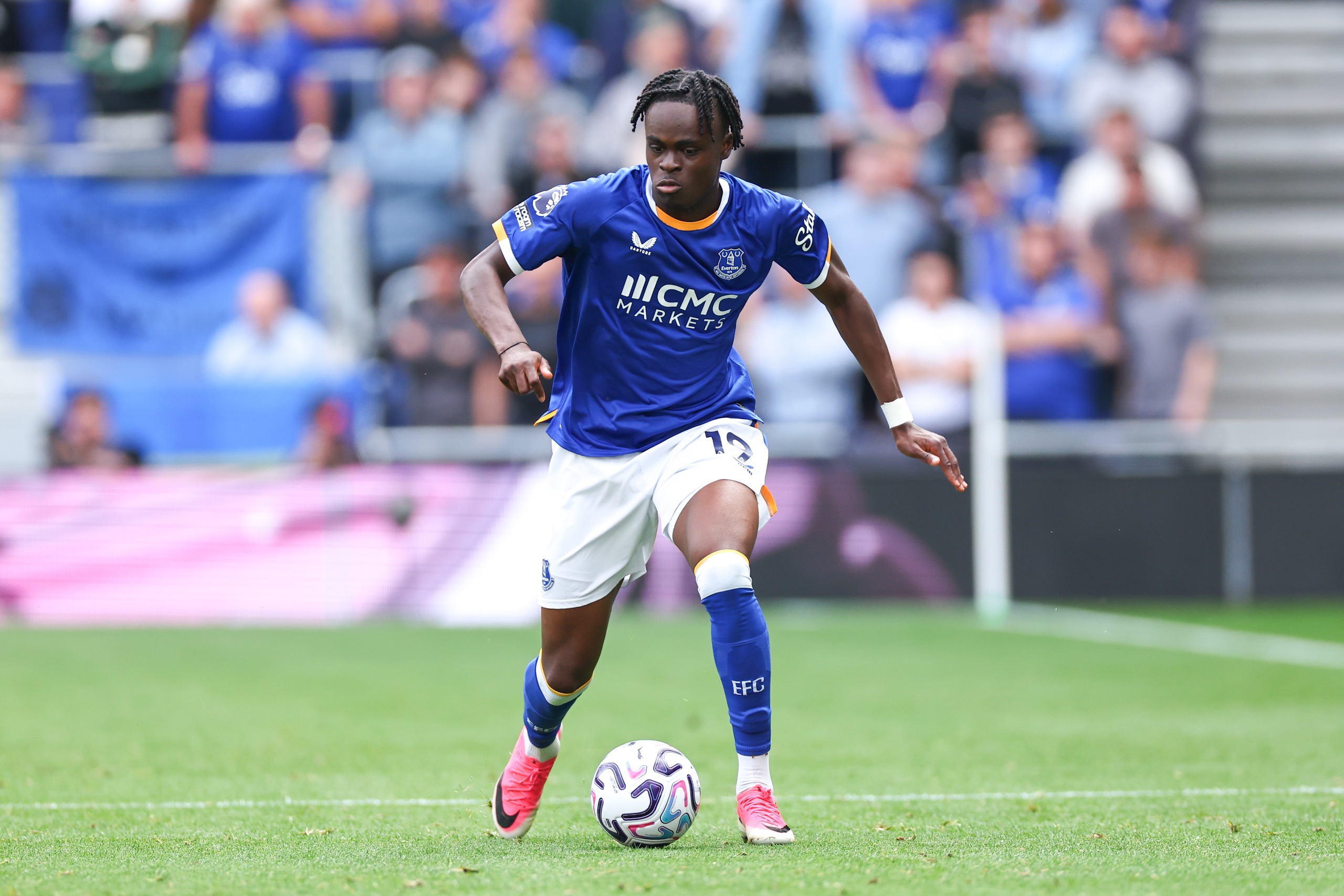 Tyrique George dribbles with the ball