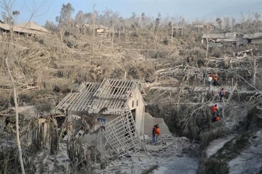 Indonesian search and rescue teams explore the area after Mount Merapi volcano erupted the night before in the village of Pakem in Sleman, Yogyakarta province.