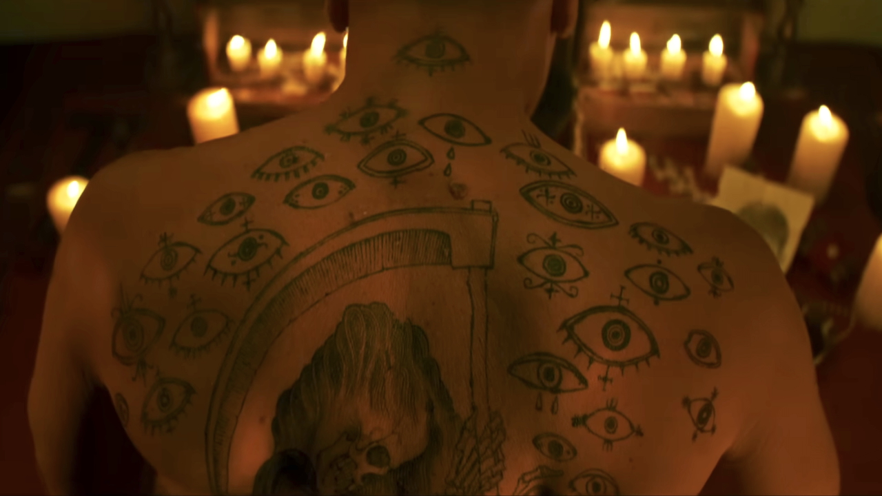 Max Cady's various back tattoos, including eyes surrounding a central Grim Reaper, in Cape Fear TV show