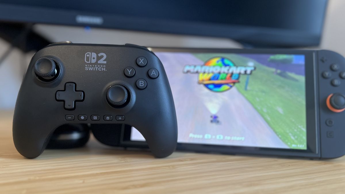 PowerA Advantage Controller with a Nintendo Switch 2 console playing Mario Kart World on a wooden desk