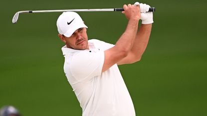 Brooks Koepka takes a shot on the second hole during the second round of the 2023 Masters