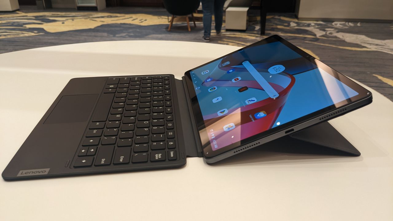 Lenovo Tab P11 Pro Gen 2 on a round wooden table.