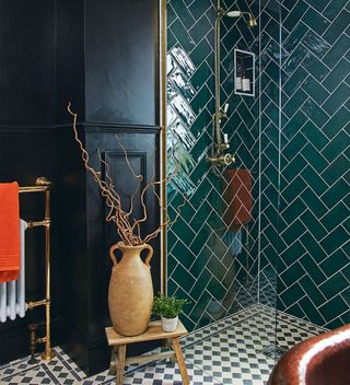 Bathroom with back walls, monochrome floor tiles and green shower wall tiles