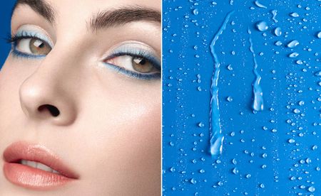 Model Vittoria Ceretti wearing blue Chanel eyeliner and beads of water on a blue background