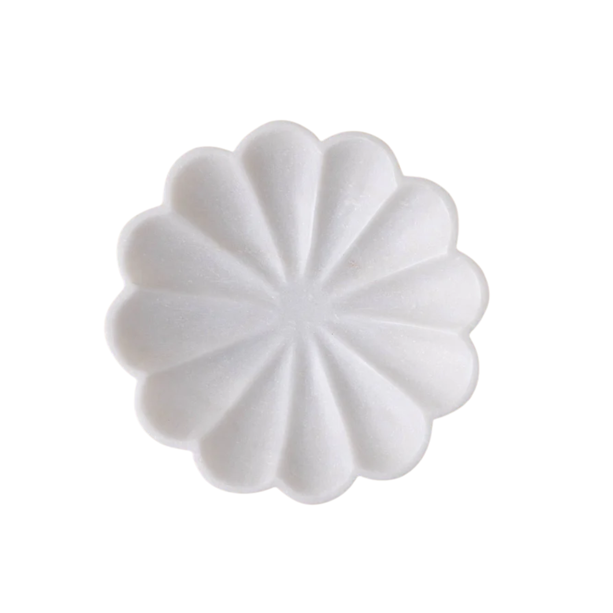 a marble bowl with scallop detail