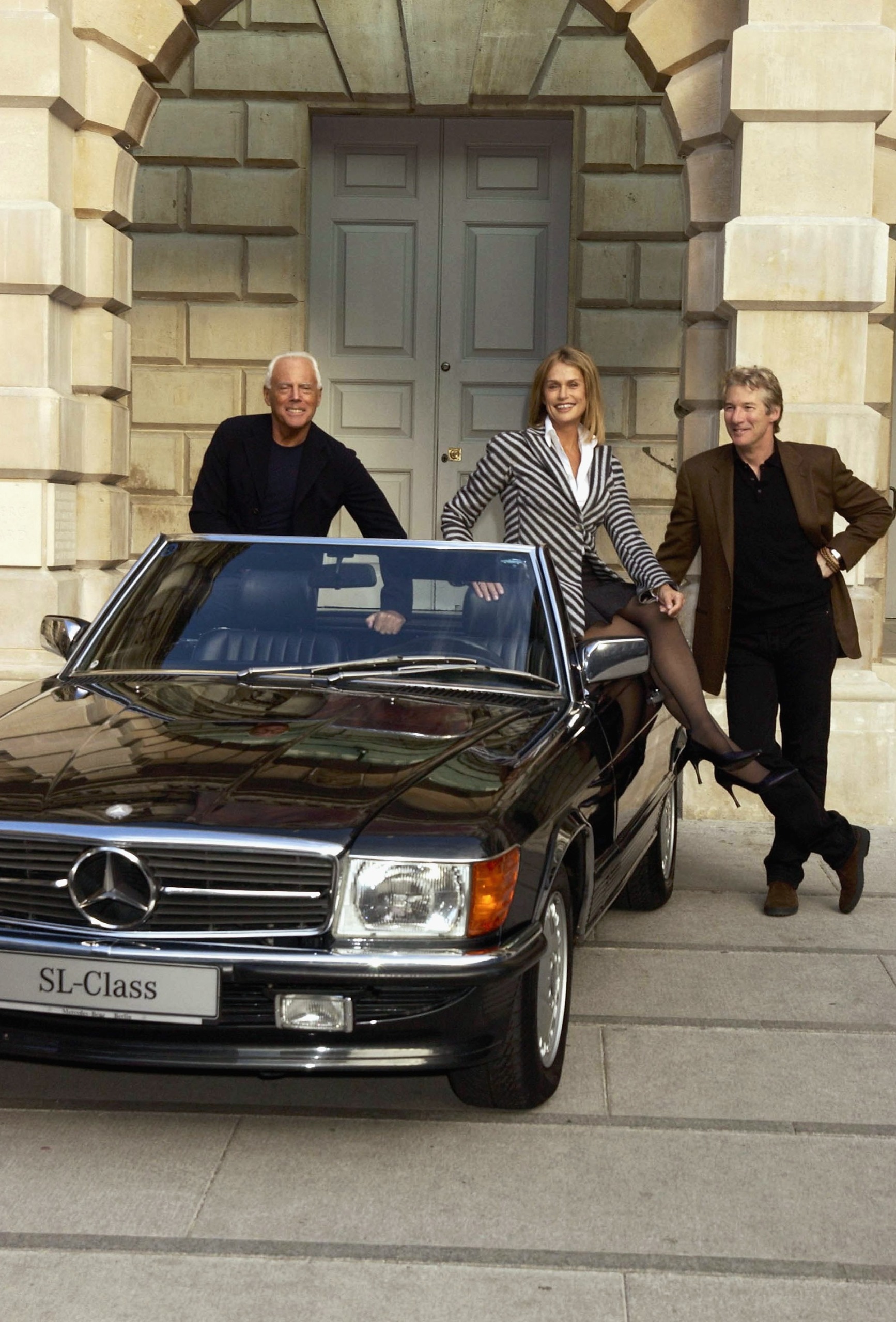 Giorgio Armani Lauren Hutton and Richard Gere with a car