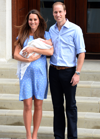 Prince William, Duke of Cambridge and Catherine, Duchess of Cambridge with their newborn son pose for the media before departing the Lindo Wing of St Mary's Hospital on July 23, 2013 in London, England