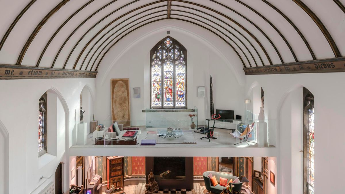 view inside chapel conversion with vaulted ceiling and glass mezzanine