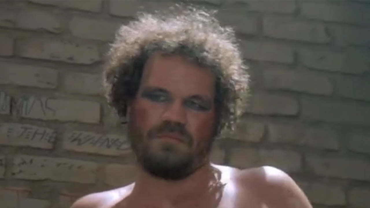A close up of Randall "Tex" Cobb in makeup in Fletch Lives