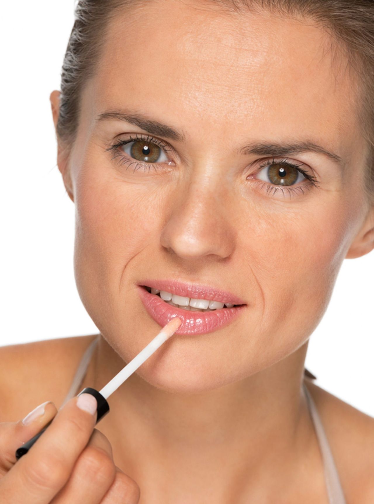 Woman applying lip gloss