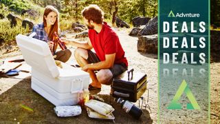 Couple drinking beers from cooler outdoors