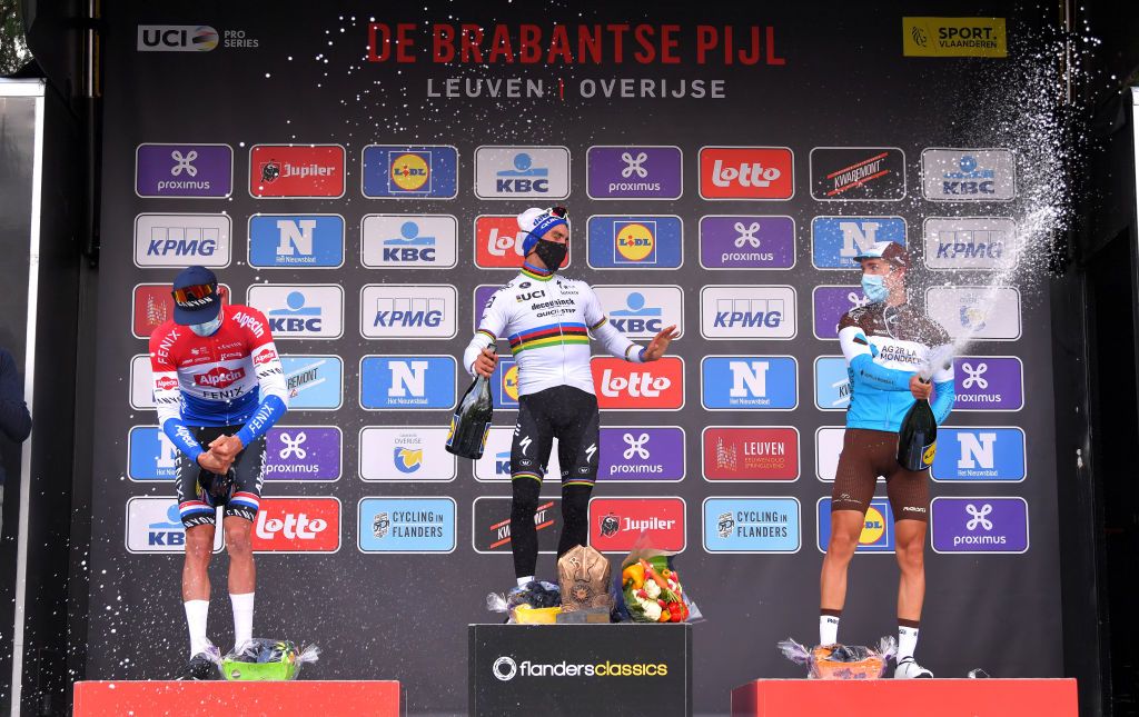 OVERIJSE BELGIUM OCTOBER 07 Podium Mathieu Van Der Poel of Netherlands and Team AlpecinFenix Julian Alaphilippe of France and Team Deceuninck QuickStep Benoit Cosnefroy of France and Team Ag2R La Mondiale Celebration Champagne during the 60th Brabantse Pijl 2020 Men Elite a 197km race from Leuven to OverijseSchavei 106m La Flche Brabanonne BP20 on October 07 2020 in Overijse Belgium Photo by Luc ClaessenGetty Images