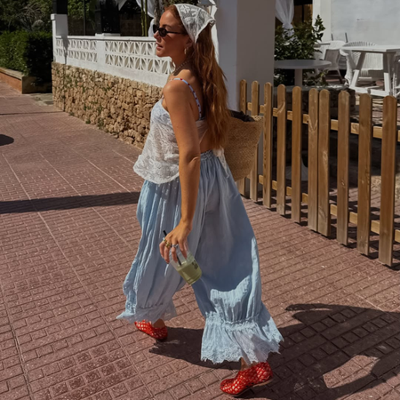 Influencer Rebecca Ferraz Wyatt wearing a bandana top, bloomers and jelly shoes. 