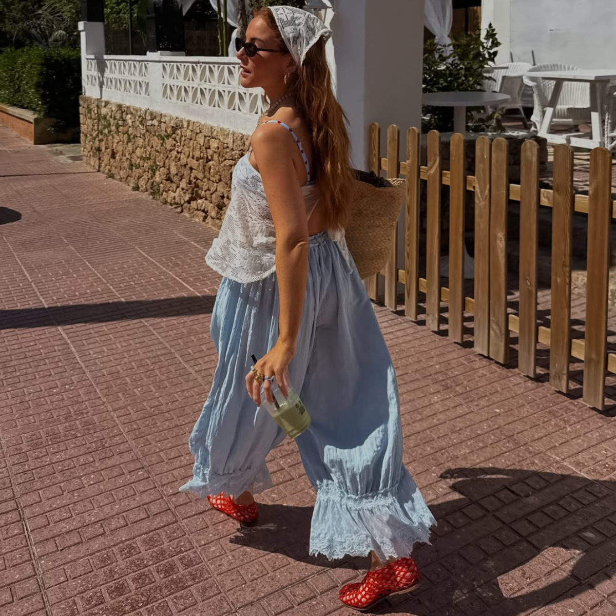 Influencer Rebecca Ferraz Wyatt wearing a bandana top, bloomers and jelly shoes. 