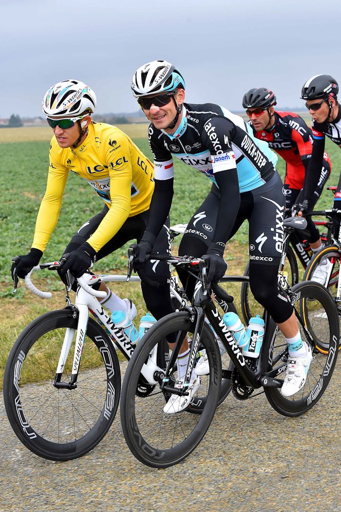 Kwiatkowski in yellow talks with countryman and teammate Michal Golas.