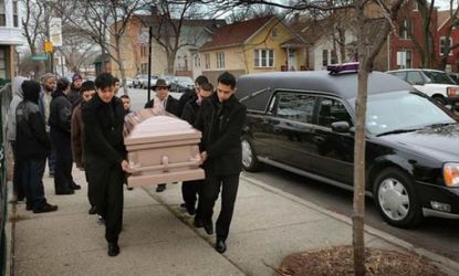 Pallbearers carry the body of 14-year-old Chicagoan Rey Dorantes, who was shot six times on his front porch on Jan. 11.