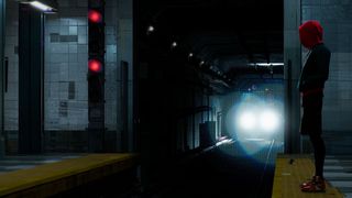 A train approaching in a dark tunnel