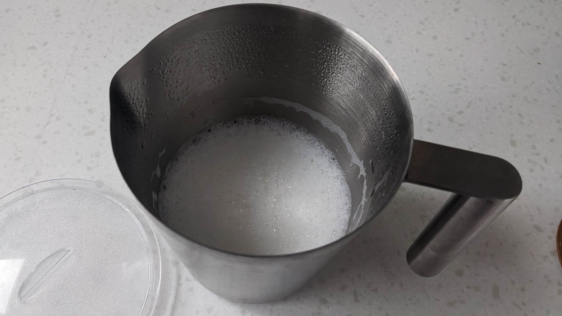 Frothed milk in whisk