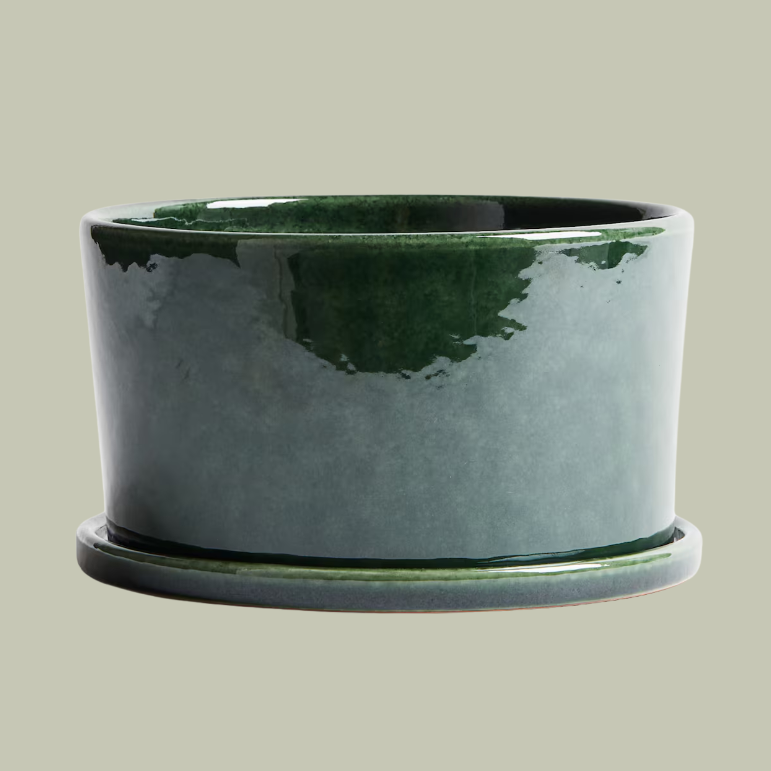 A glazed ceramic wide planter in green