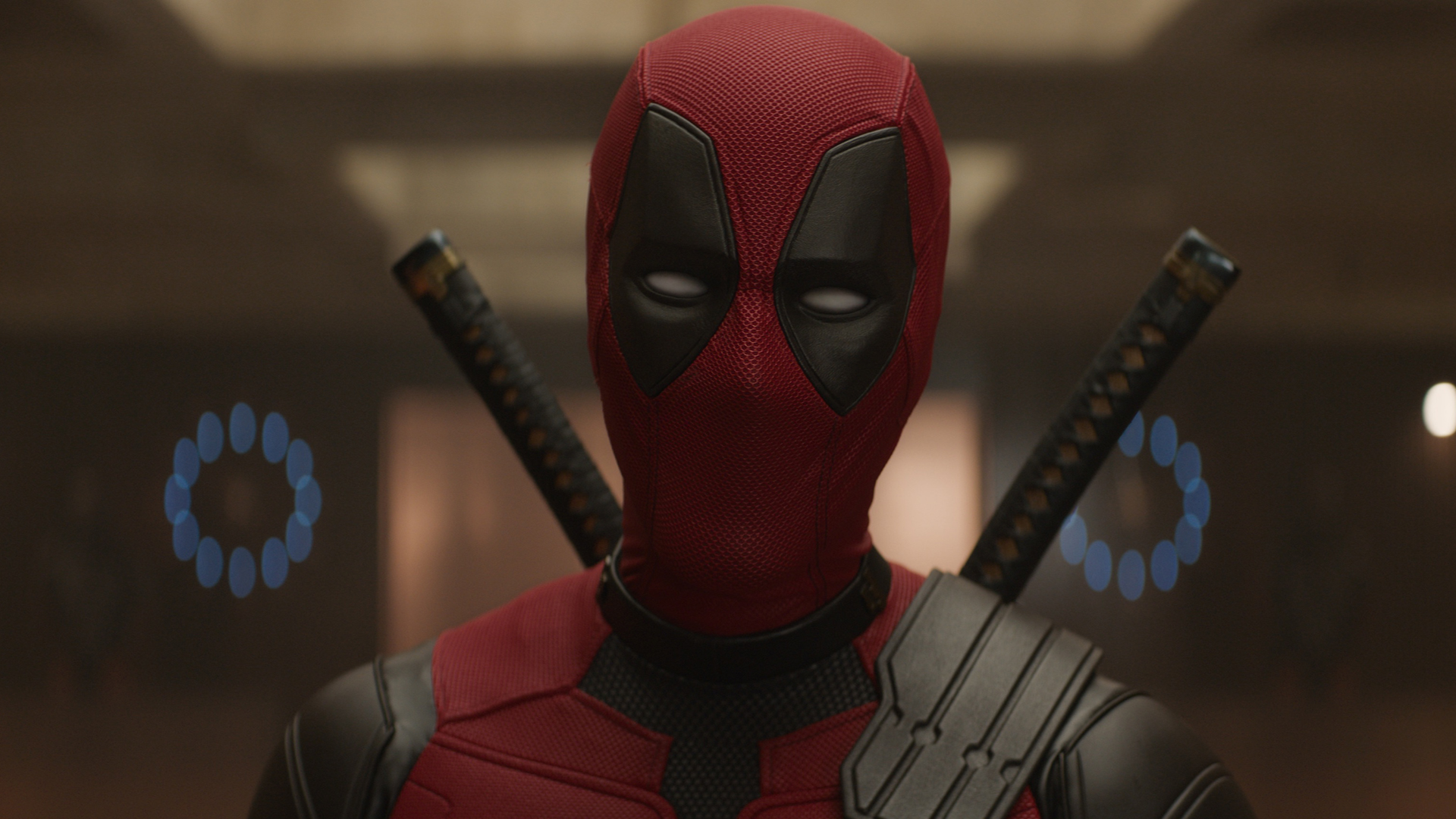 A costumed Wade Wilson stares at something off camera in Deadpool and Wolverine