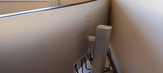 A Dell UltraSharp U4924DW monitor sitting on a desk