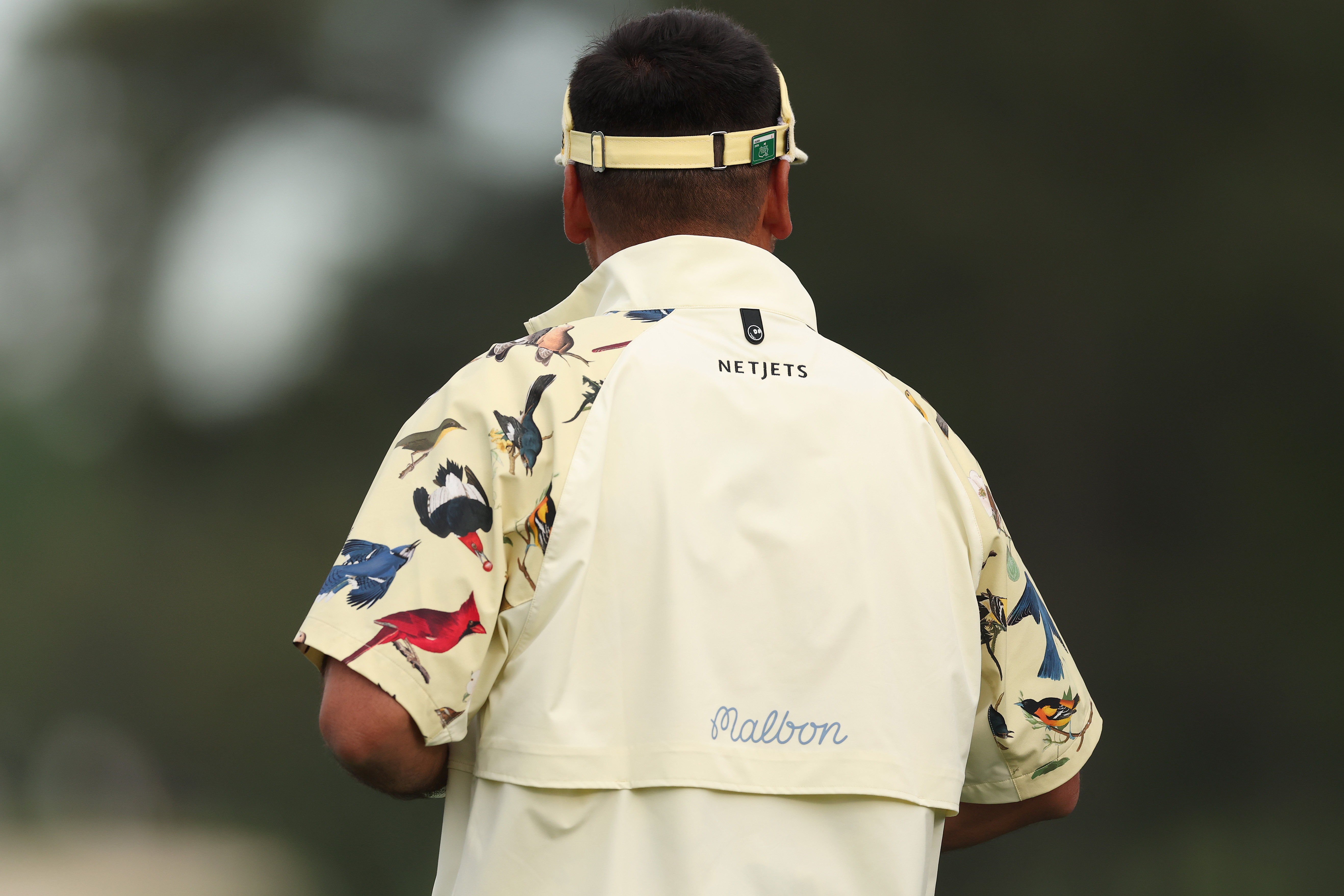 A detailed view of the jacket worn by Jason Day of Australia during a practice round prior to the 2026 Masters Tournament at Augusta National Golf Club