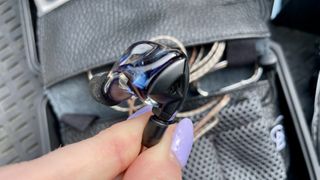 Campfire Audio Clara held in a hand, or worn by a woman