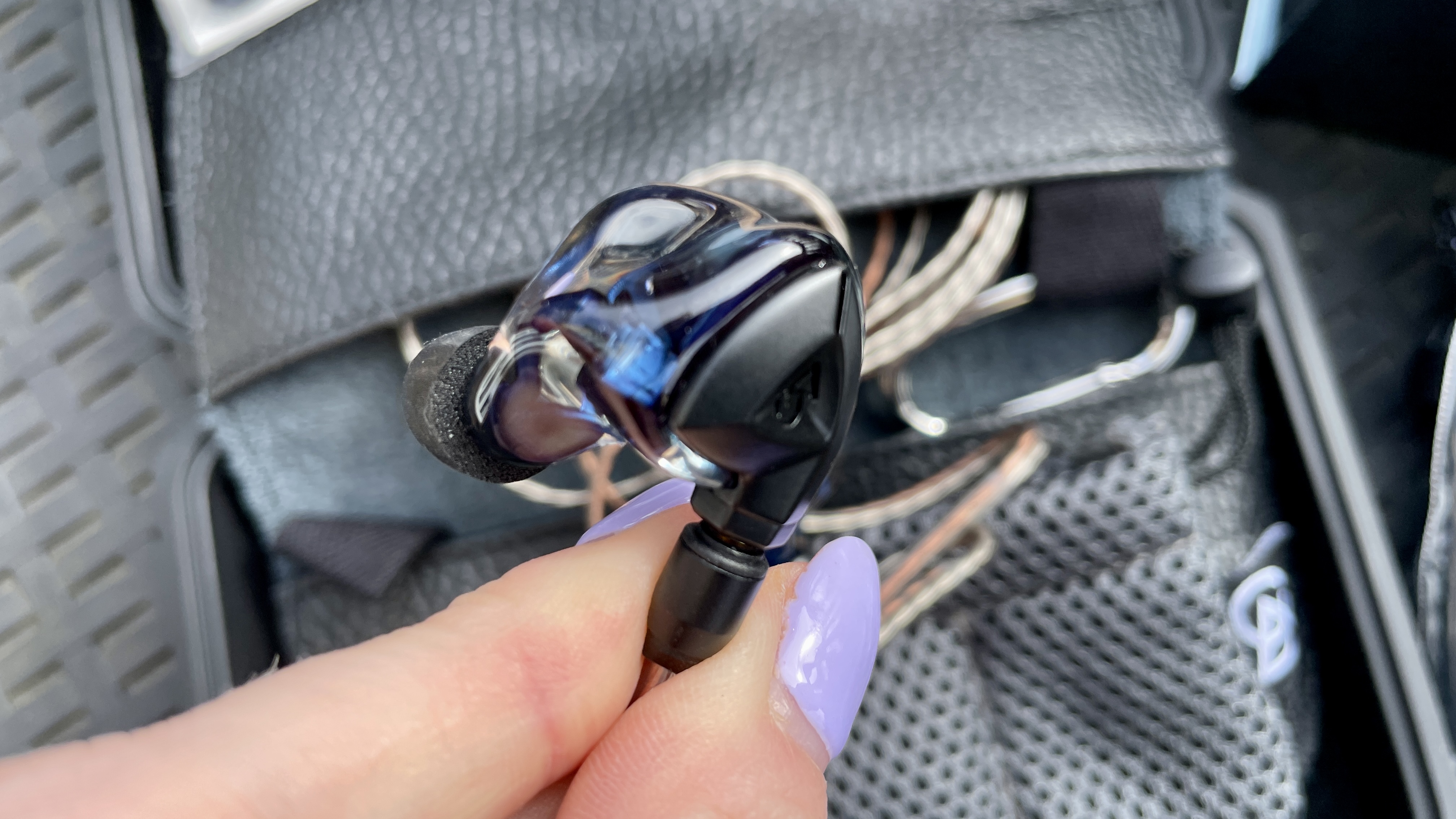 Campfire Audio Clara held in a hand, or worn by a woman