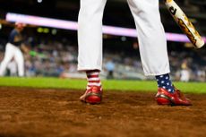 Stars and stripes socks on the baseball field.