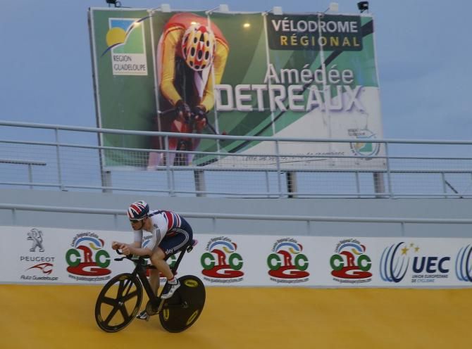 A Britsih team pursuit rider goes high on the track