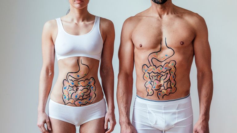 Man and a woman highlight their good gut health practises