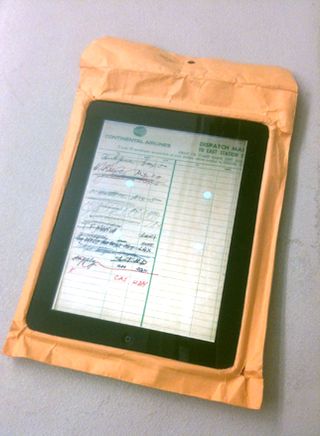 brown envelope with an Ipad screen inserted in the front