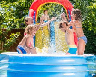 inflatable pool slide with children playing