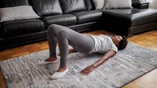 Woman doing pilates for beginners poses at home