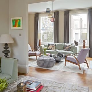 living room with sofa armchairs and wooden flooring