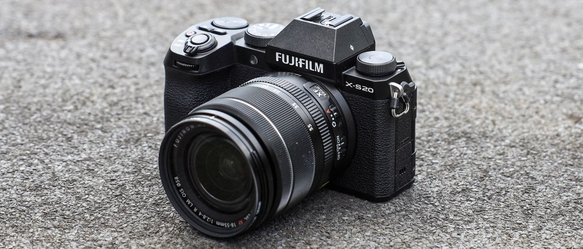 Fujifilm X-S20 sitting on a grey carpet