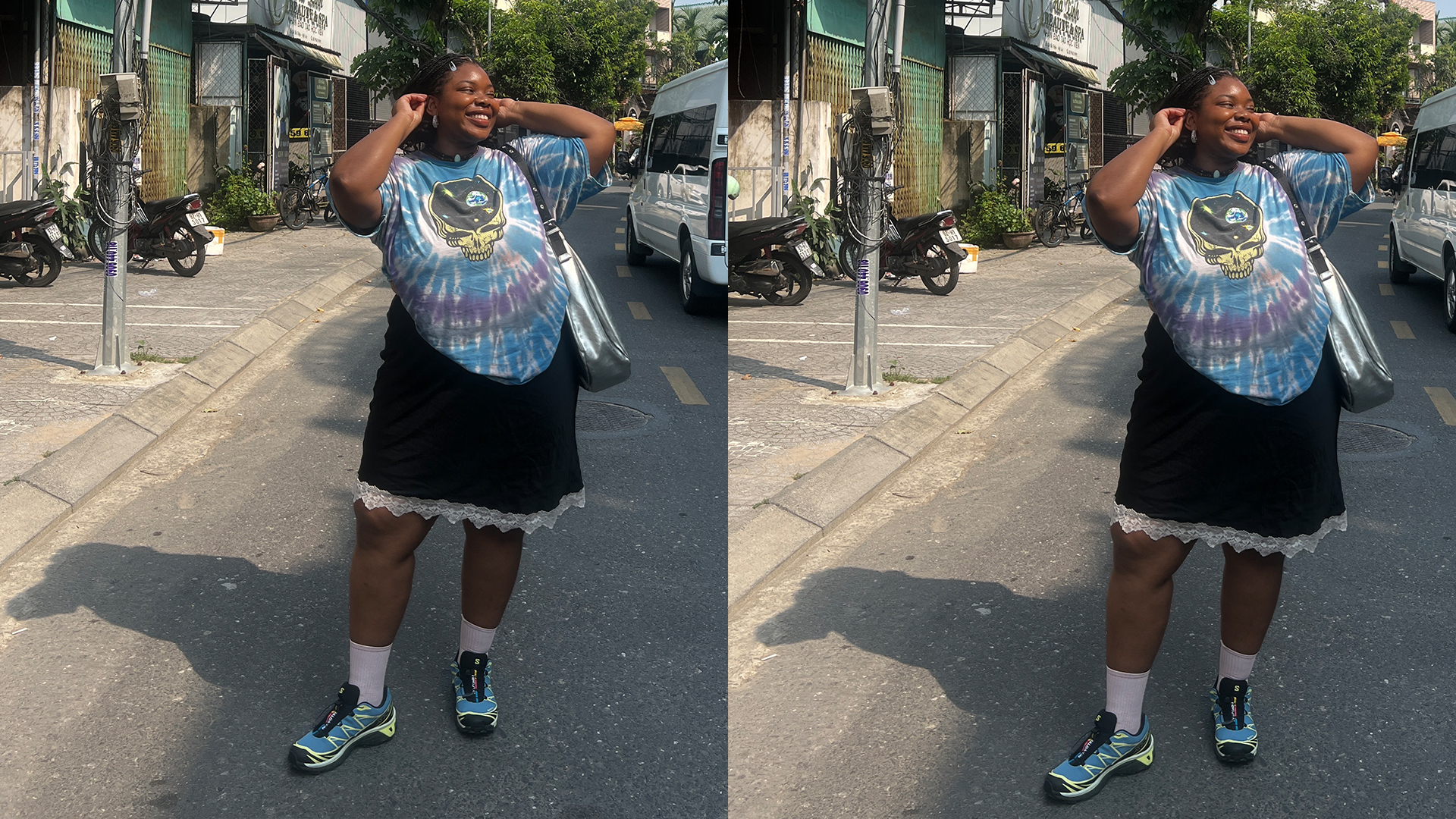 Chichi poses in the streets of Hoi An, Vietnam. She is wearing a blue tie-die graphic t-shirt, black skirt with lace trim, and blue Saloman sneakers while carrying a silver handbag. 